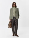 Брюки из эко кожи с акцентными хлястиками